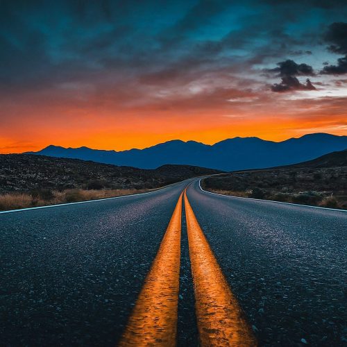 Nighttime,Setting,,Dark,Road,,Vivid,Blue,Mountains,In,The,Background,